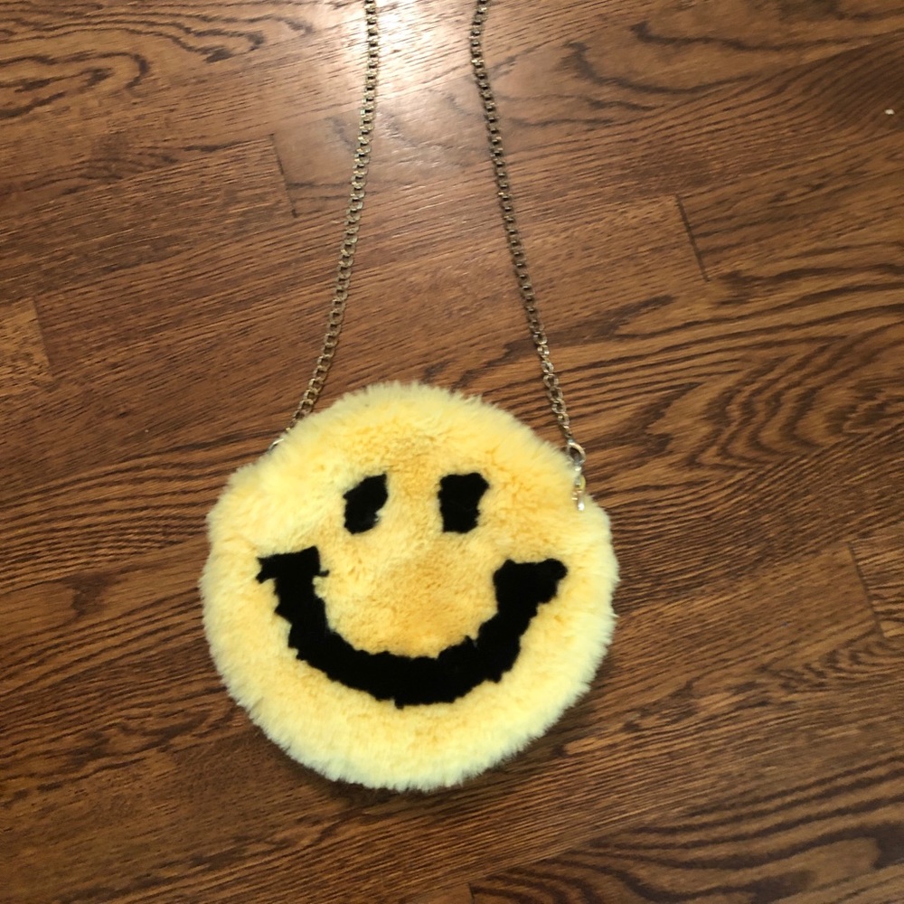 Soft, plush, smiley face purse.